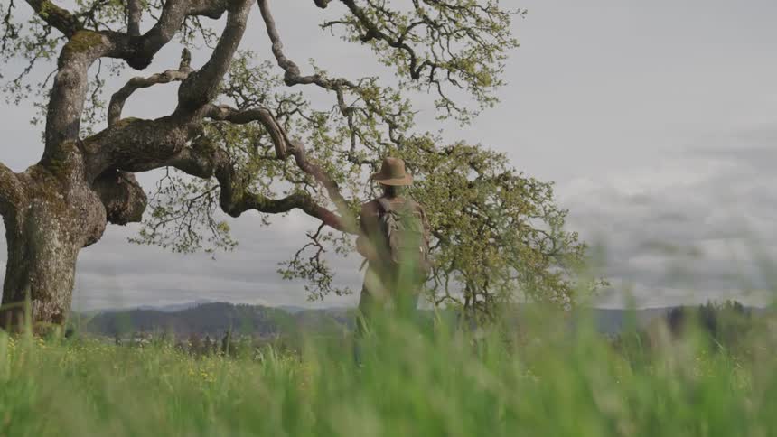Woman standing in front of a tree