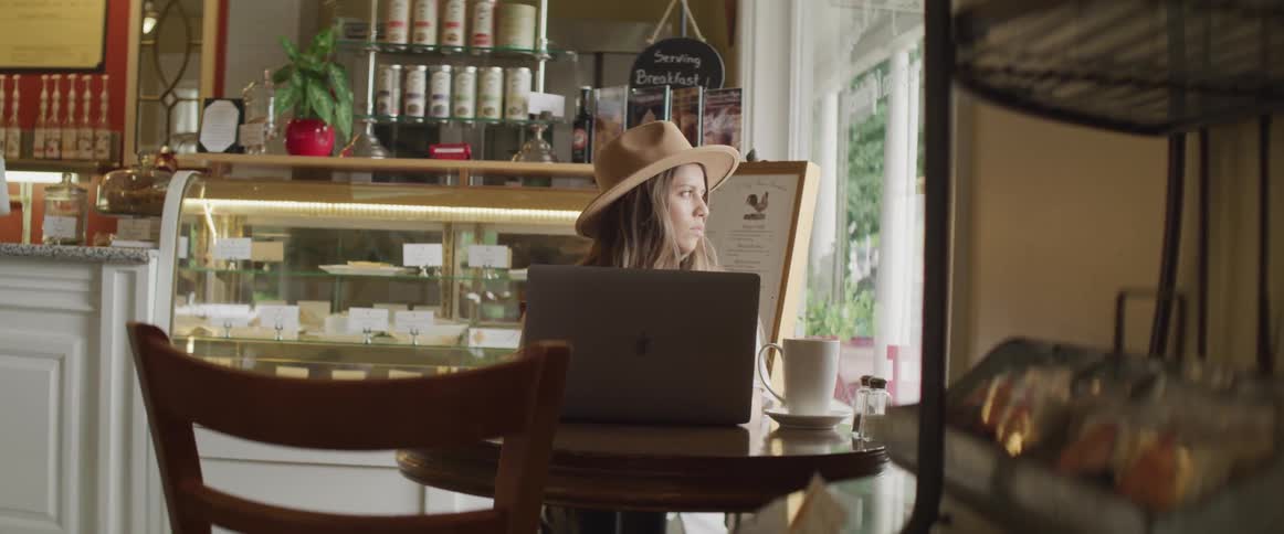 Girl sitting in a shop at a computer