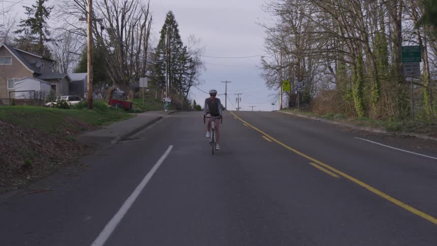 Girl riding her bike on a street