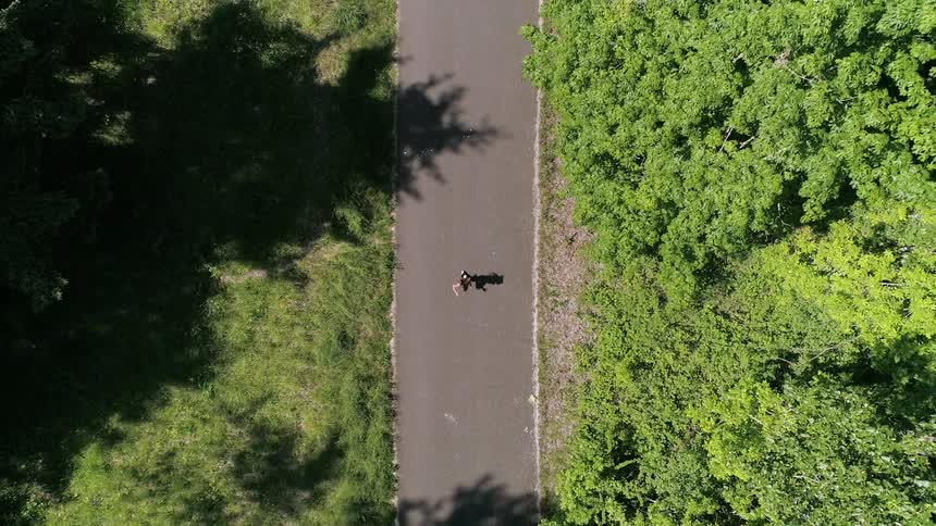 Person running down a trail
