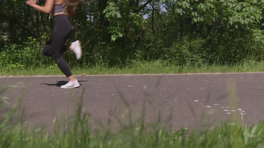 Girl running on aphalt