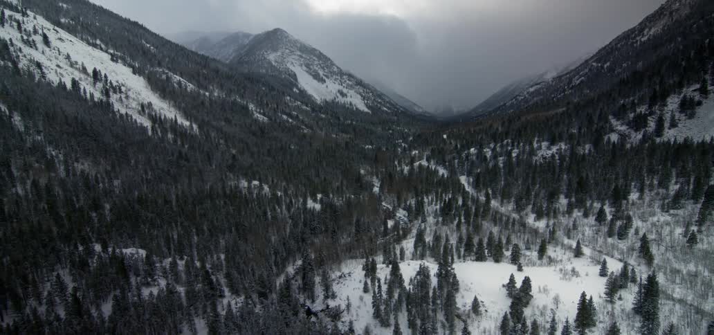 Aerial view of mountains covered in snow