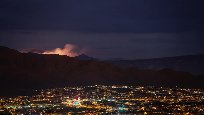 Landscape view of a city at night during a storm