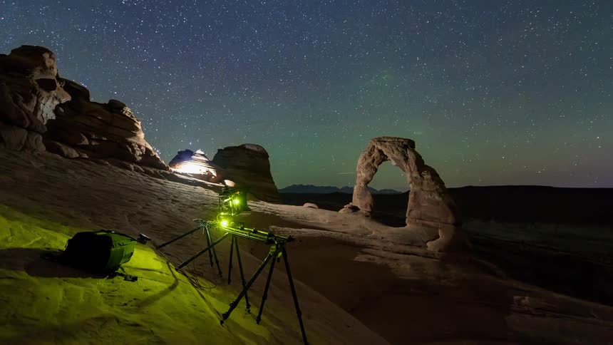 A camera on a track taking footage in the desert
