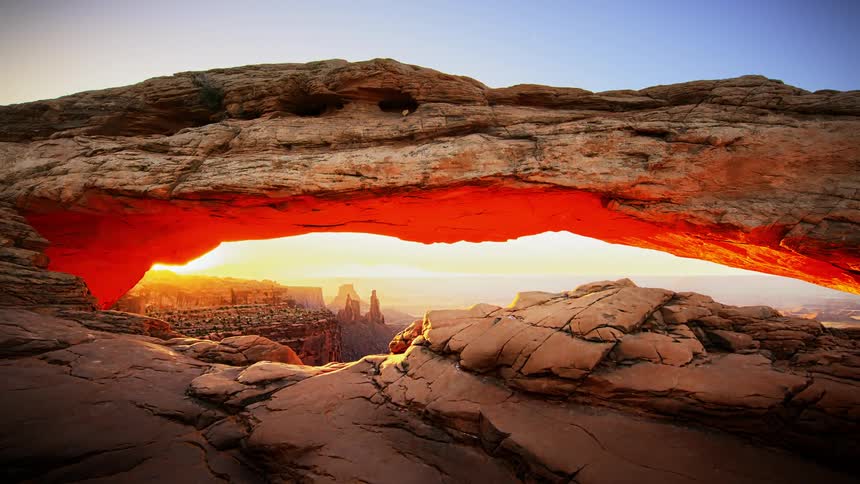 An unusual rock formation on the edge of a deep canyon
