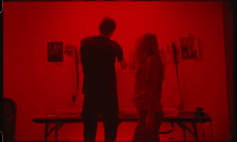 Couple put photograph on the wall at the bleaching room