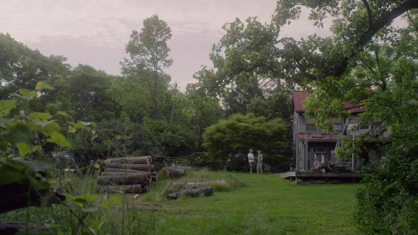 2 man meet at the backyard on the rural area
