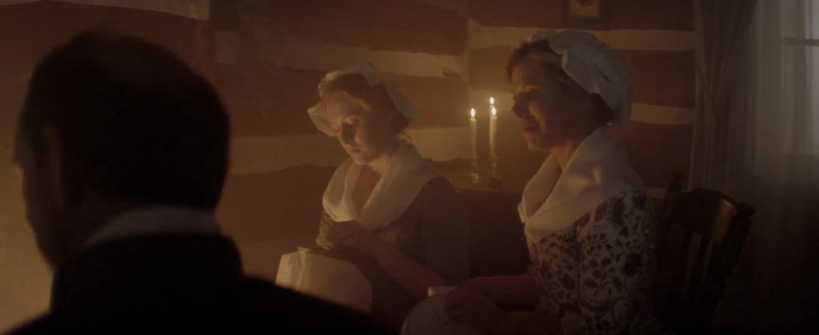 A group of people wear classic outfit inside a house