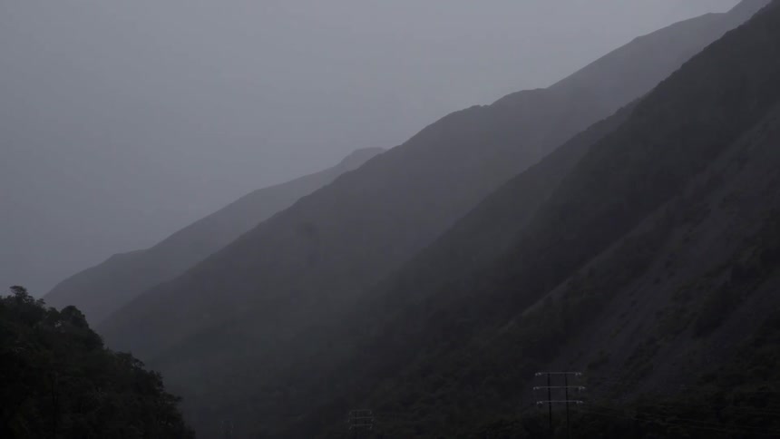 Fog Rolling Over Mountain Peaks Creating Mystical Quiet Landscape and Atmospheric Nature Mood.
