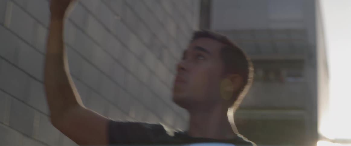 Man performing dance moves on a city street