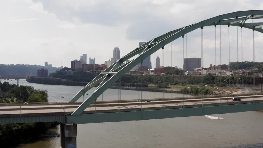 Cars drive over the bridge