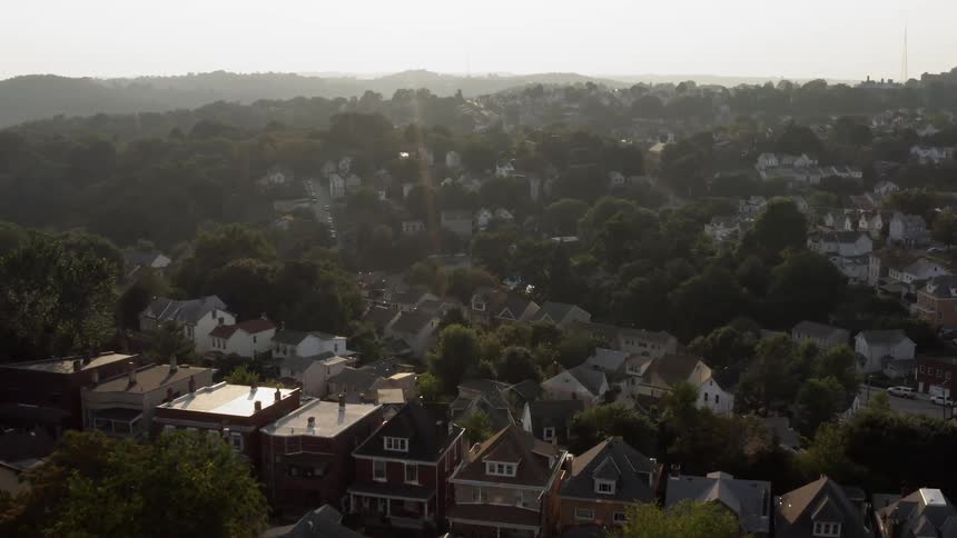 An aerial view of a suburban area is displayed