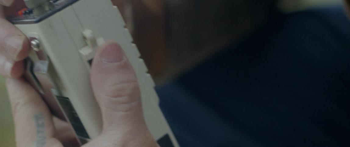 Man adjusting a white colored machine