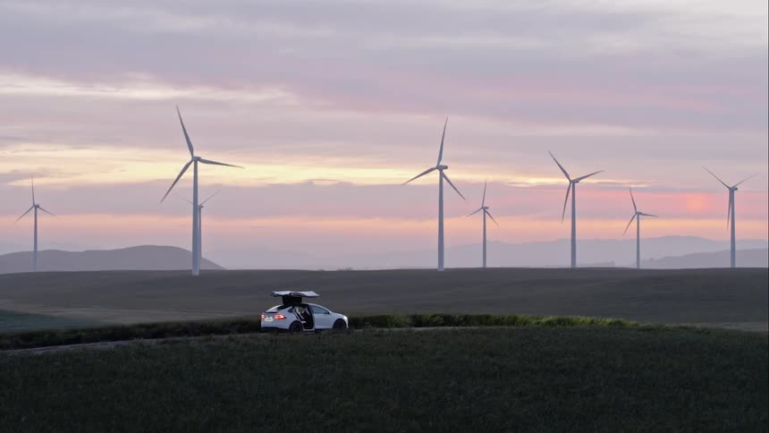 A scenery of a wind mill field at dawn