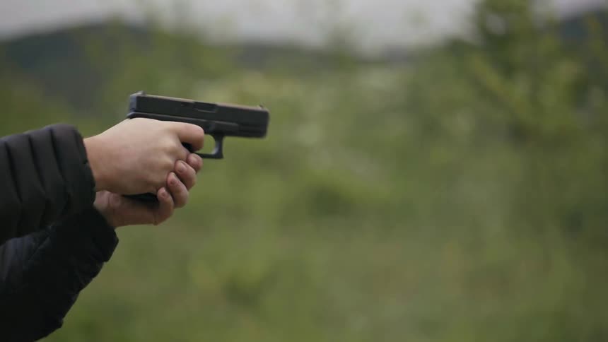 A person shooting a gun