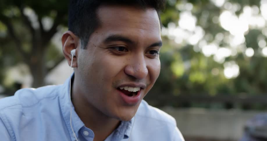 A young man is talking to someone
