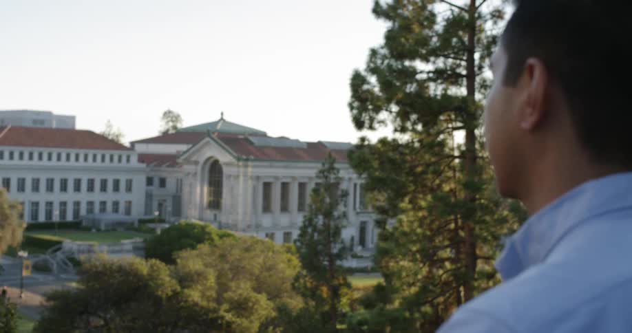 A man is looking at a building outdoors