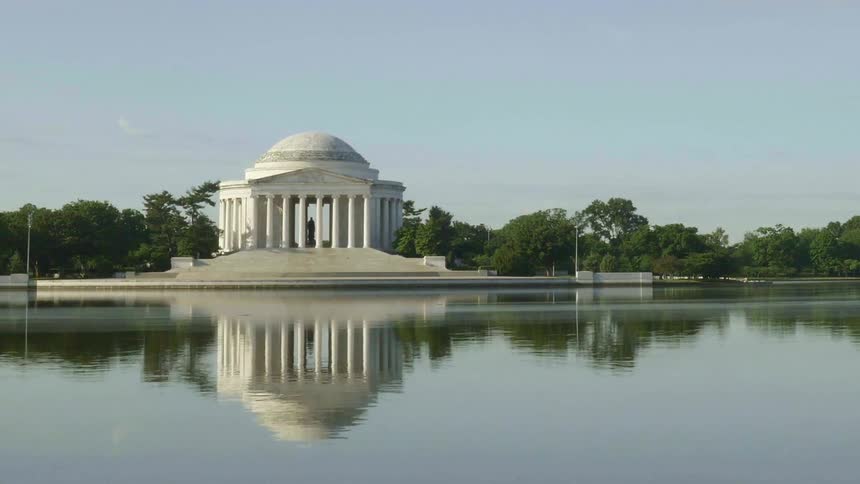 Water ripples in front of a monument building
