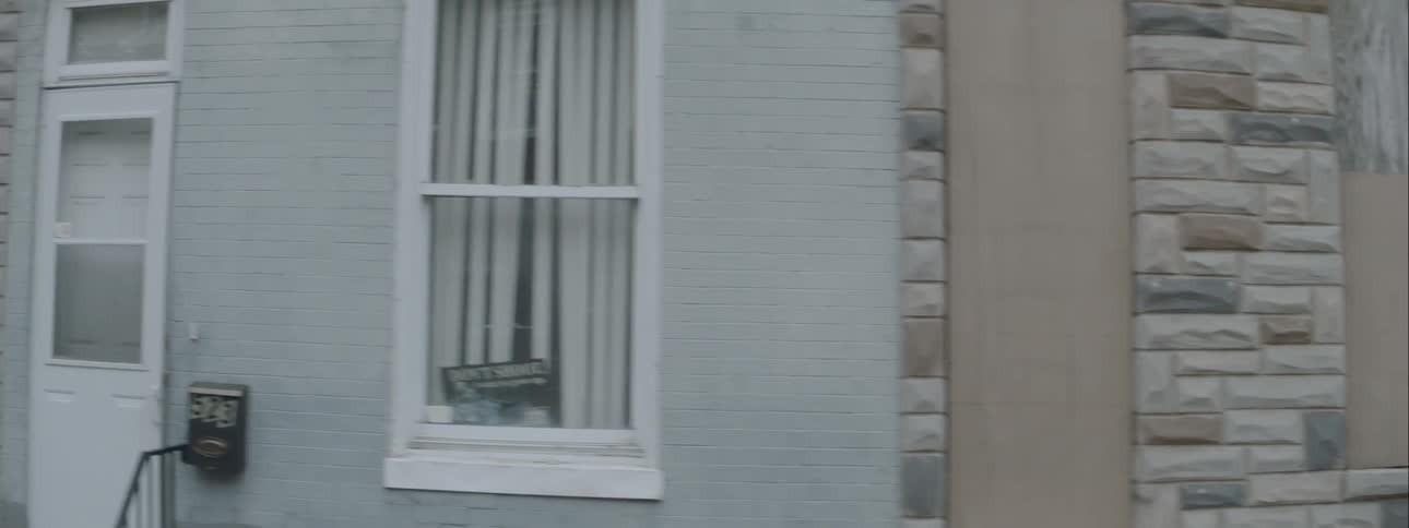 The building is lined with windows and stone