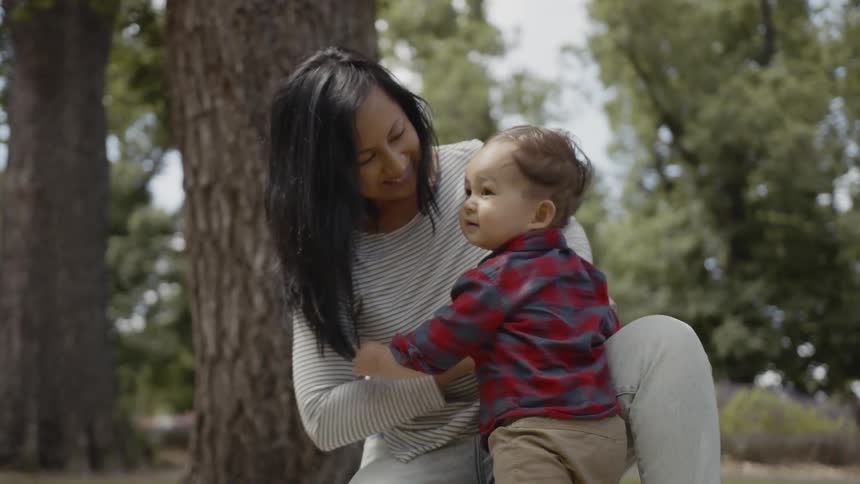 Mother and child are outside playing