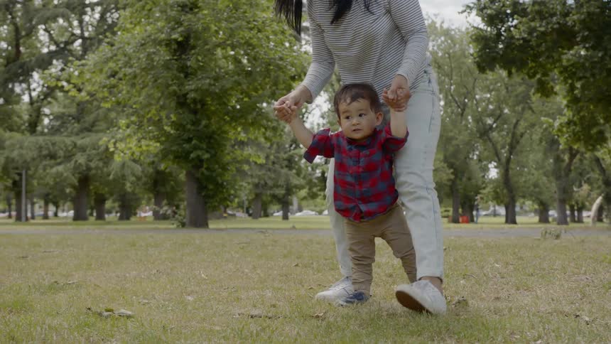 Mother and child are playing outdoors