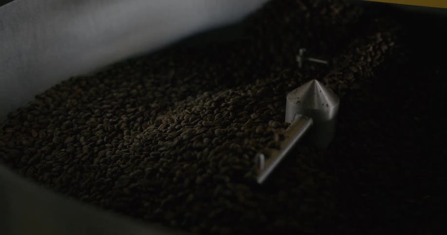 Coffee beans turning in a large coffee roaster