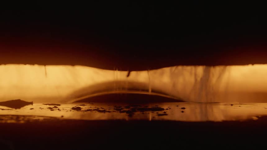 Water drips on machinery in a factory
