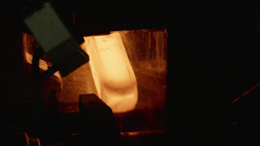 Heated metal going into a machine with water