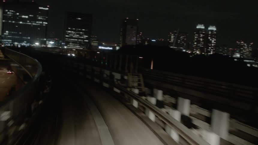A highway and landscape of a city at night