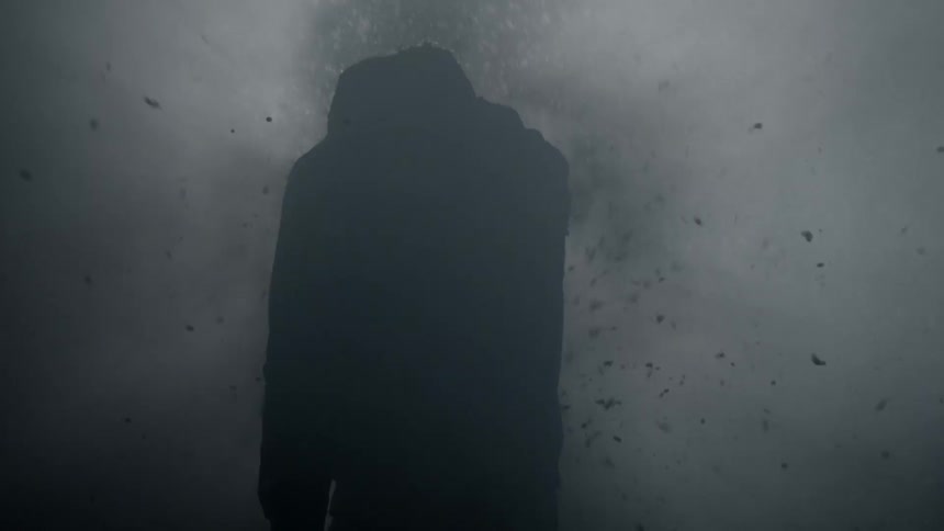 Man walking through debris