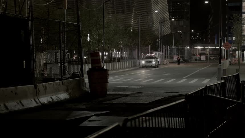 A police car is parked on the street