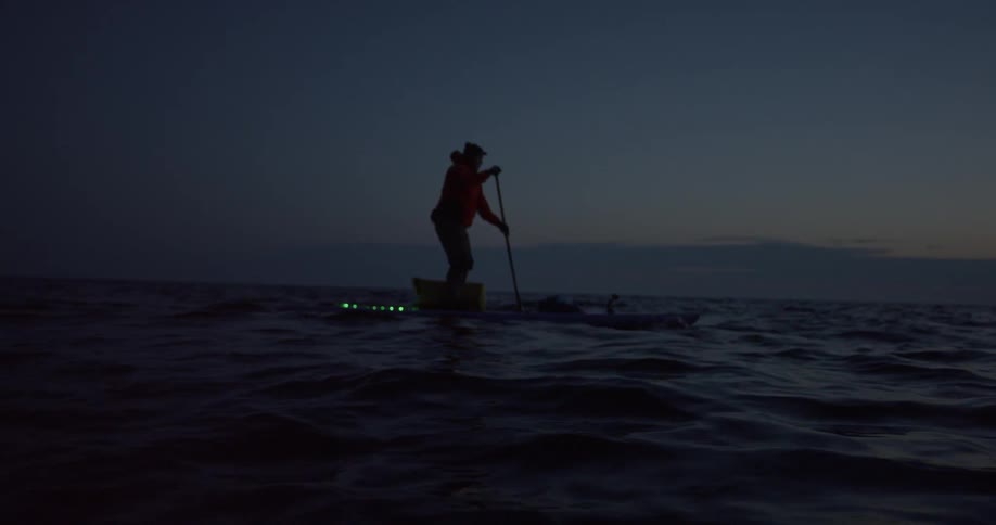 A person is on a boat in the ocean