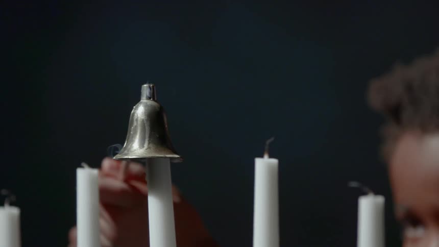 Girl quenches candle