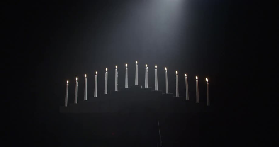 Candles lit in a stand
