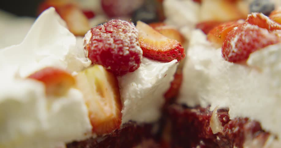 Cake with whipped cream and fruit on top