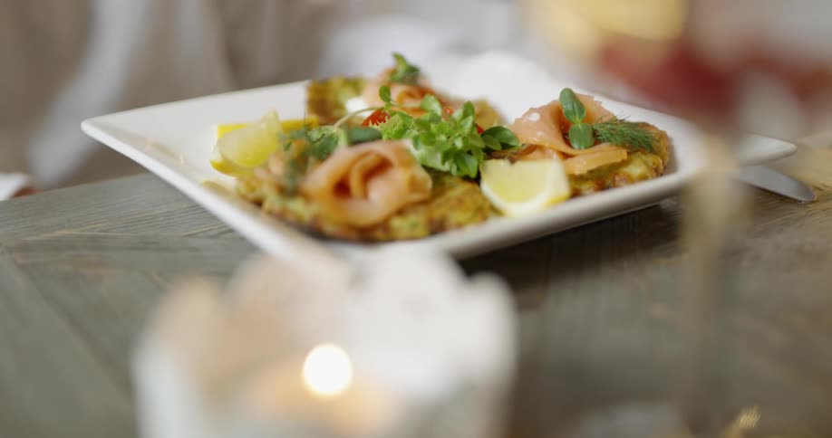Plate of food being served on a wooden table