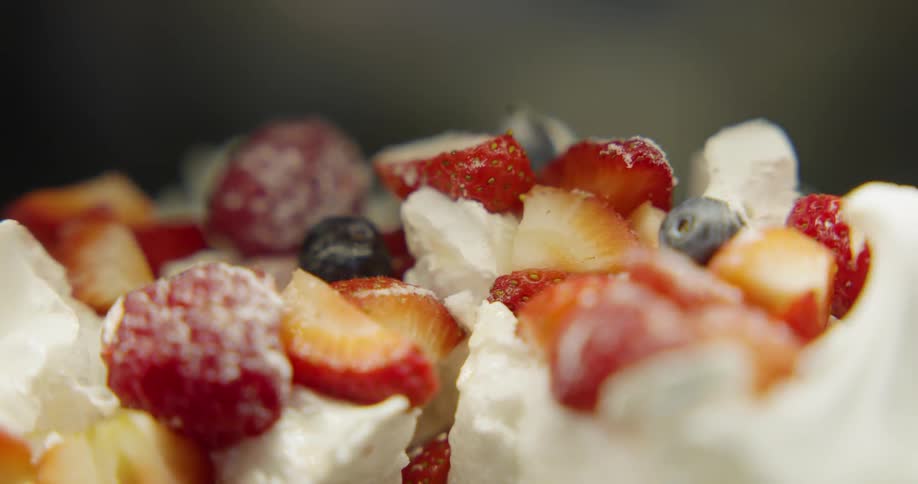 Multiple fruits top a cream dessert