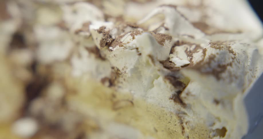 Cream and chocolate cover a dessert