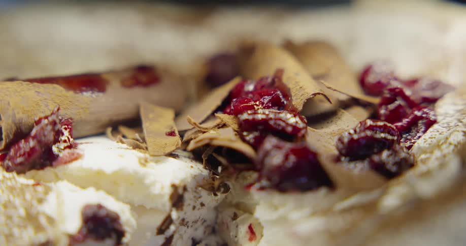 Chocolate shavings and fruit cover a dessert