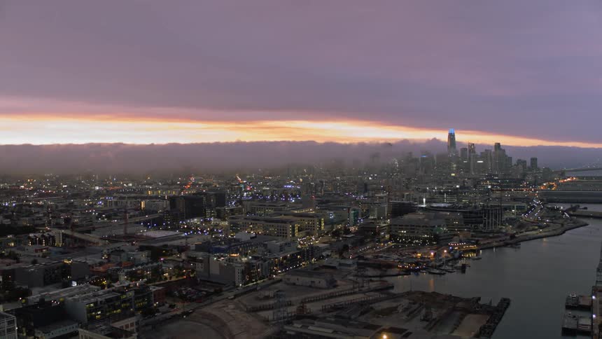 A coastal city with buildings and skyscrapers in the background