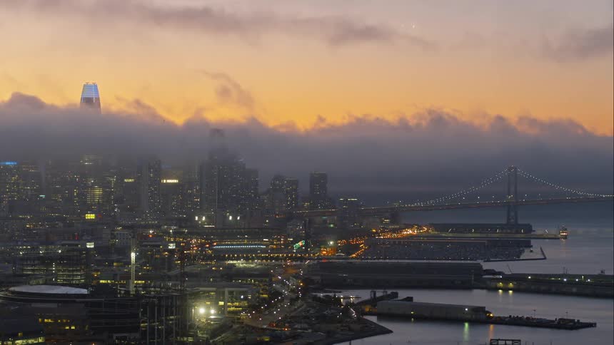 The coastline of a city during sunset
