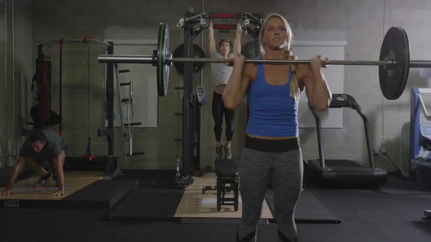 People are working out in a gym together