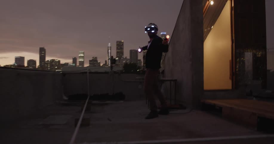 A person plays vr on a rooftop