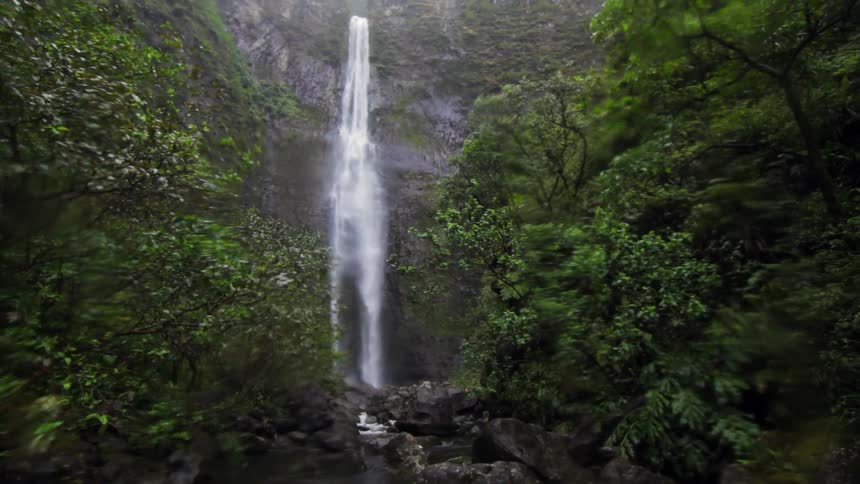 A waterfall cascades over a cliff