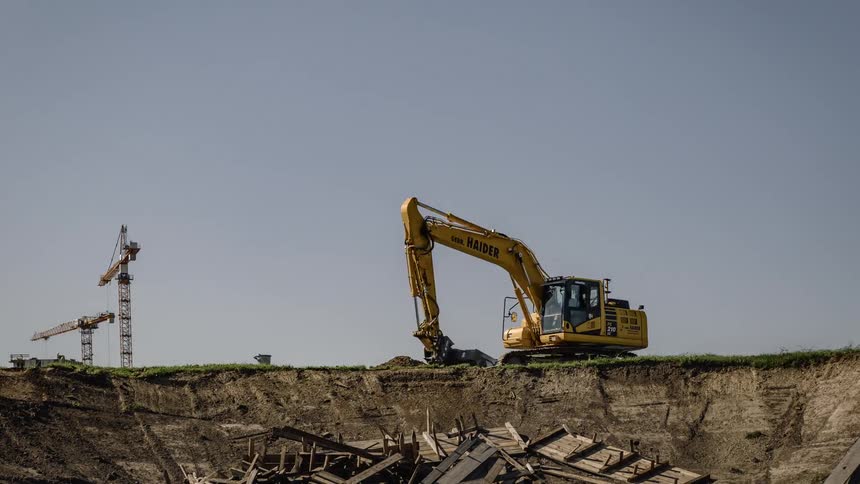 A piece of equipment moves dirt around