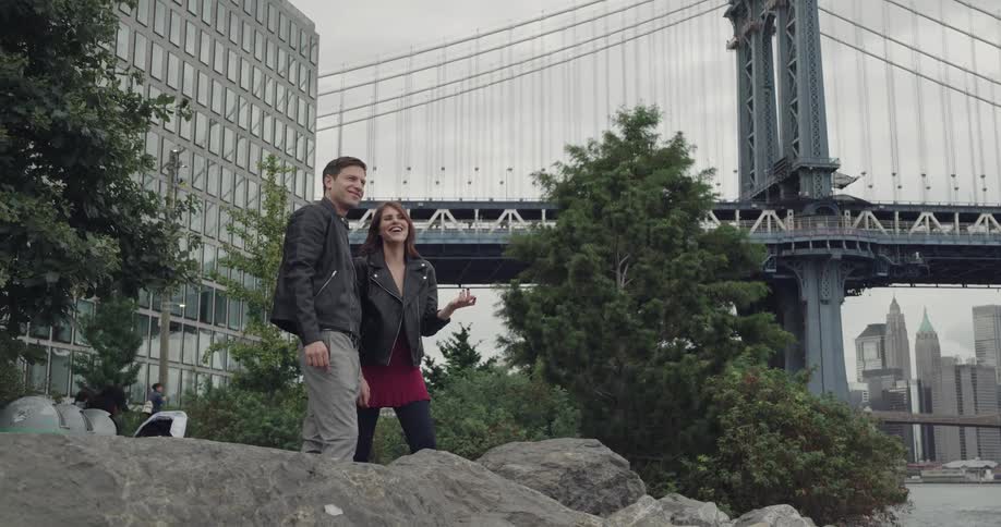Male and female are outdoors talking together