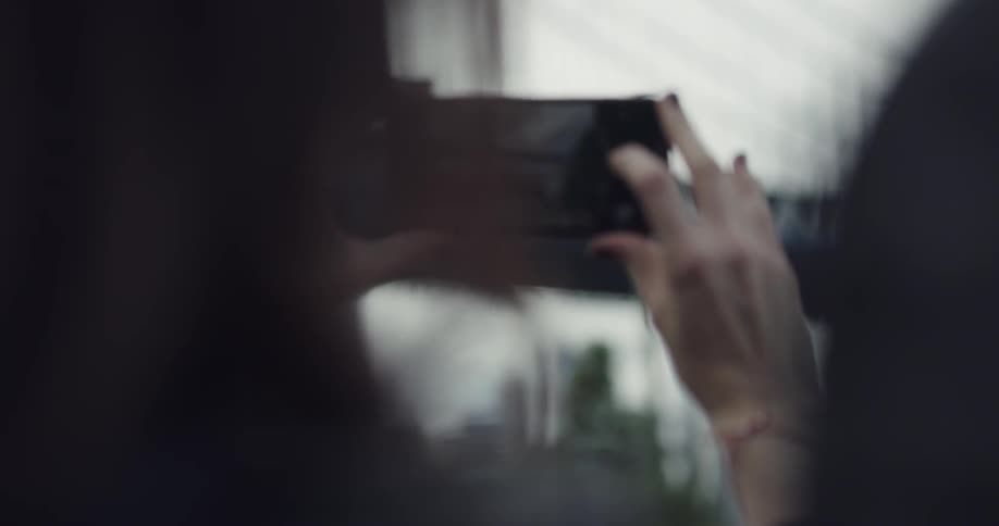 A person is taking a photo outdoors