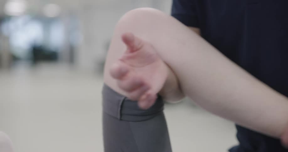 Male therapist doing leg therapy