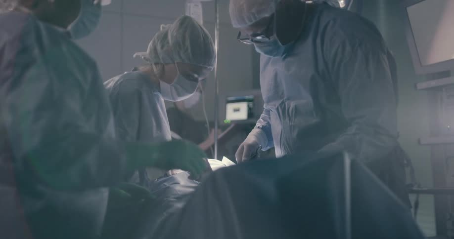 People are in an operating room at a hospital