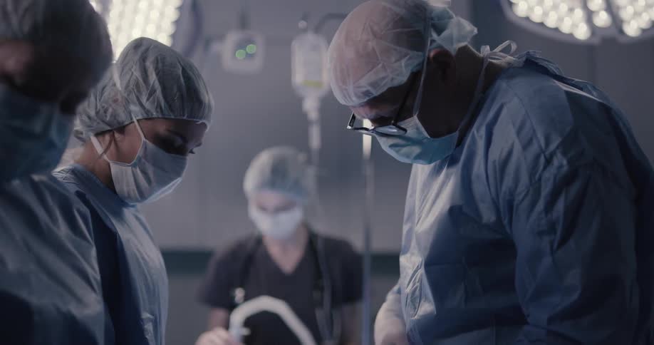 Doctors and nurses doing surgery on the operation theatrical room